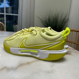 Women’s Nike Zoom Court HC tennis shoes 8. Never worn with original packaging.